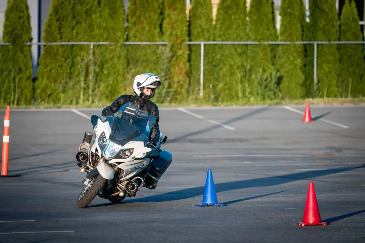 Rider on a motorcycle used for wet-weather maintenance advice
