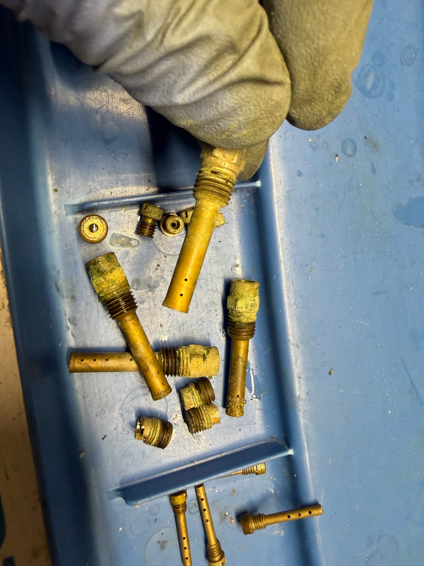 Contaminated brass jets removed from a stored Kawasaki GPZ750