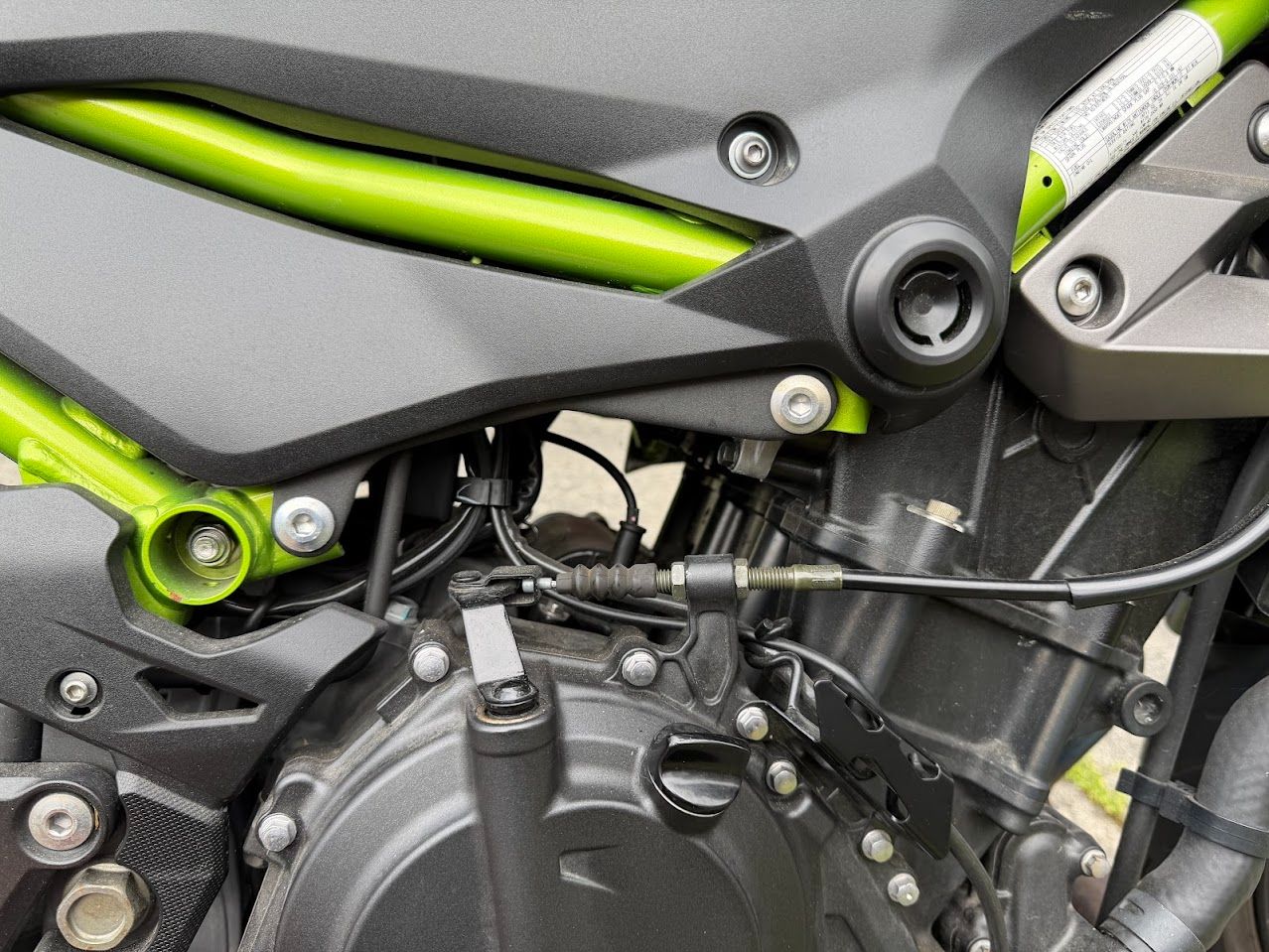 Motorcycle chassis area inspected during a post-storage service visit